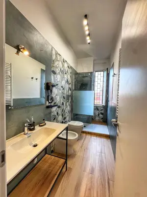 a bathroom with a sink and a toilet at Tito House in Rome