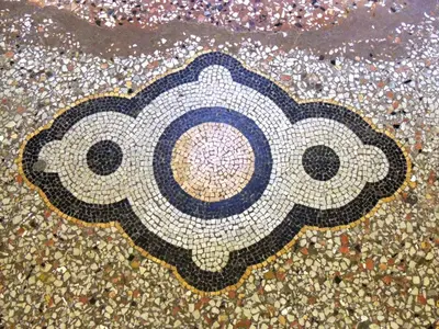 a mosaic floor with a picture of a bear on it at IL Sole in Rome