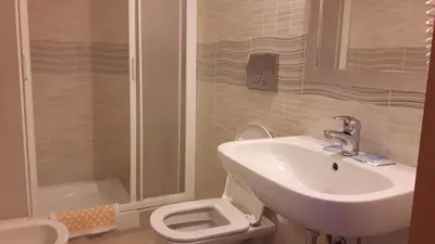 a bathroom with a sink and a toilet and a shower at IL Sole in Rome