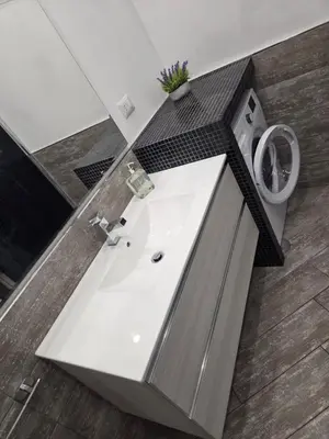a bathroom with a sink and a toilet at Barbara House Monteverde in Rome
