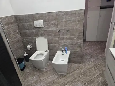 a bathroom with a toilet and a bidet at Barbara House Monteverde in Rome