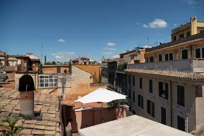 a view from the roof of a building with an umbrella at Casa Mia - Trastevere Rooftop Nest in Rome