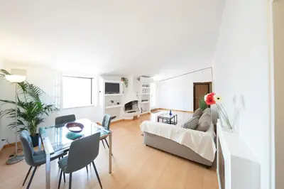 a living room with a couch and a table at Casa Mia - Trastevere Rooftop Nest in Rome