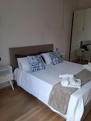 a bedroom with two beds with towels on them at Golden Suite in Rome