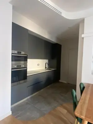a kitchen with a sink and a stove at Golden Suite in Rome