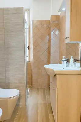 a bathroom with a sink and a toilet and a shower at Colosseo Rooms Apartments in Rome