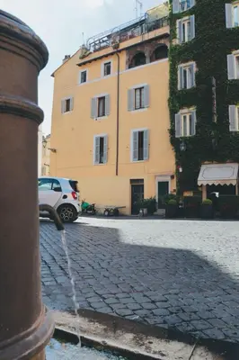 a white car parked in front of a building at Biscione Dream Campo de'Fiori in Rome