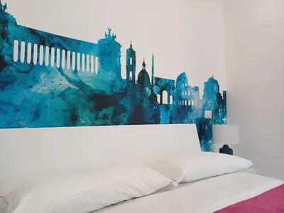 a bedroom with a white bed and a painting at Lux Urbis Pio VIII in Rome