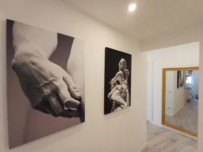 a painting of a hand hanging on a wall at Lux Urbis Pio VIII in Rome