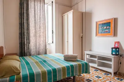a small bedroom with a bed and a window at PP Stanza Privata in Appartamento Pigneto in Rome