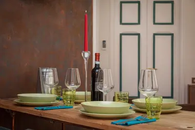 a kitchen and dining room with a table and chairs at Argilla Apartment in Rome