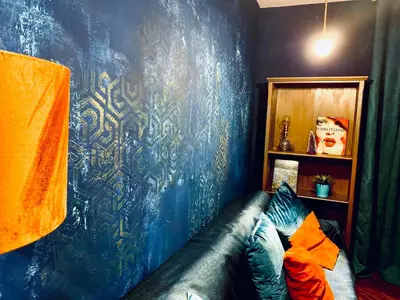 a living room with a bed and a couch at Argilla Apartment in Rome