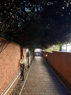 a bike parked next to a brick wall at Charme Holidays San Saba in Rome