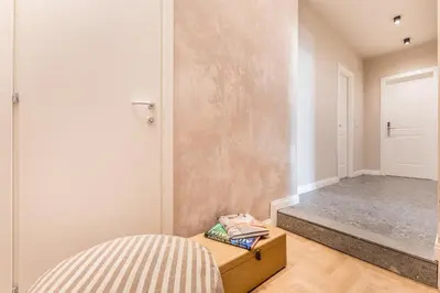 a room with a door and a table with a drawer at APT ROME - Guest House Casini 6 Trastevere in Rome