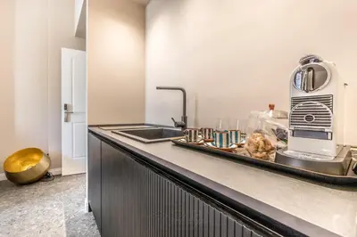a kitchen with a sink and a toaster on a counter at APT ROME - Guest House Casini 6 Trastevere in Rome