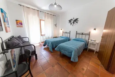 a room with two beds and a couch at wonderful apartment in Rome