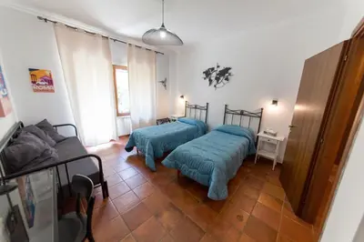 a living room with two beds and a couch at wonderful apartment in Rome