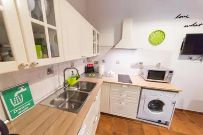 a kitchen with a sink and a washing machine at wonderful apartment in Rome