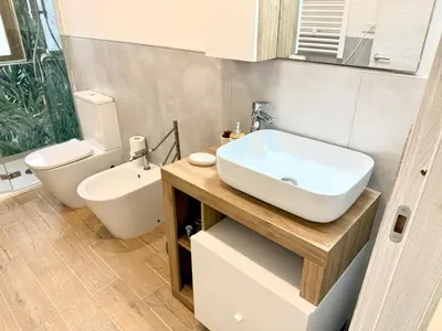 a bathroom with a sink and a toilet at Domus Basilica San Paolo in Rome