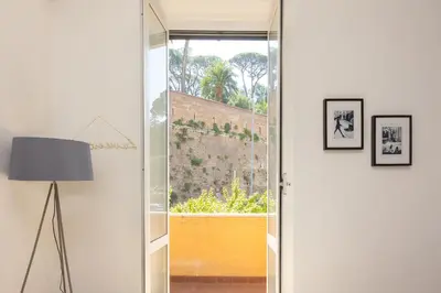 a room with a glass door and a lamp at Vatican Walls Apartment in Rome