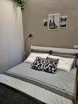 a bed with two pillows on it in a bedroom at Monolocale luminoso vicino Trastevere in Rome