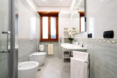 a bathroom with a toilet and a sink at Modern Apartment near Vatican & Foro Italico - Rome in Rome