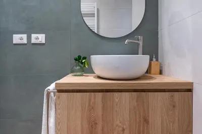 a bathroom with a bowl sink and a mirror at Casa Bressan in Rome