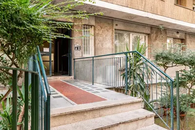 a building with a staircase leading to a door at Casa Bressan in Rome