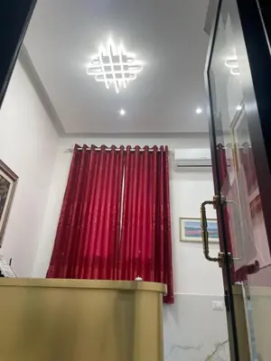 a room with a red curtain and a chandelier at Euromoon in Rome