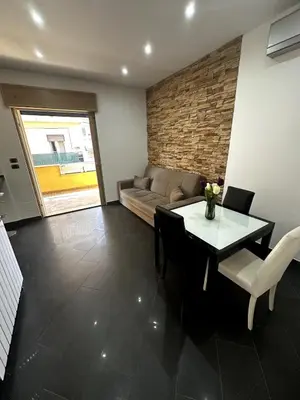 a living room with a table and a couch at Dimora Battistini in Rome