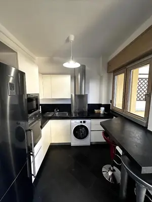 a kitchen with a stove and a refrigerator at Dimora Battistini in Rome