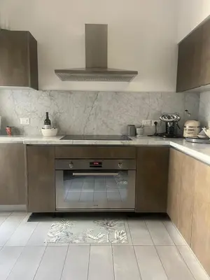 a kitchen with a sink and a stove at Large Room with private Bathroom in Rome