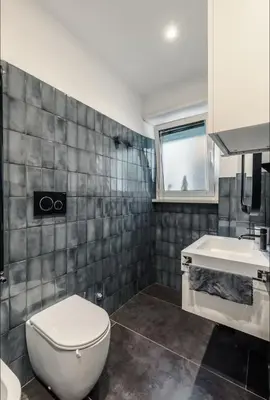 a bathroom with a toilet and a sink at Large Room with private Bathroom in Rome