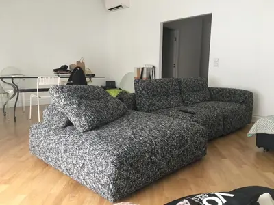 a living room with a couch and a table at Large Room with private Bathroom in Rome