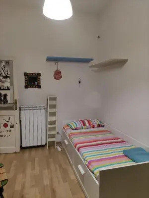 a bedroom with a bed in a room at camera singola al Pigneto in Rome