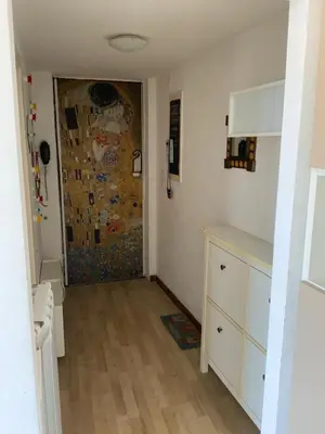 a room with a door and a room with a kitchen at camera singola al Pigneto in Rome
