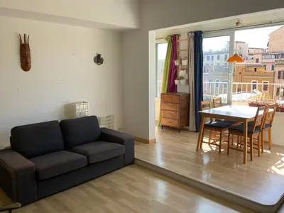 a living room with a couch and a table at camera singola al Pigneto in Rome