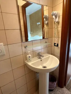 a bathroom with a sink and a mirror at Near Termini station in Rome