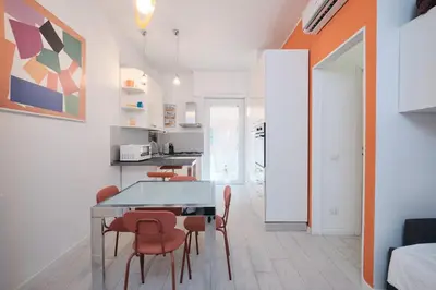 a kitchen and dining room with a table and chairs at Apt at Tiburtina Station Free WiFi e Netflix in Rome