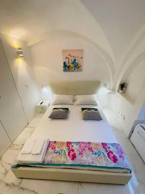 a bedroom with a large bed in a room at Loft Flower Colosseum in Rome