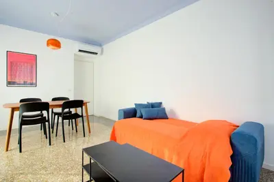 a bedroom with a bed and a table and chairs at Casa Chiro 79 in Rome