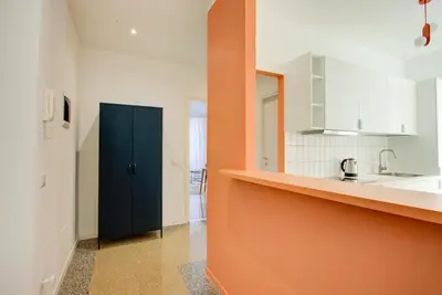 a kitchen with a black door and a counter at Casa Chiro 79 in Rome
