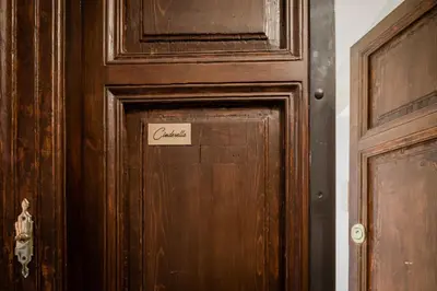 a wooden door with a sign on it at Tiber Island View - Trastevere, Campo de' Fiori in Rome