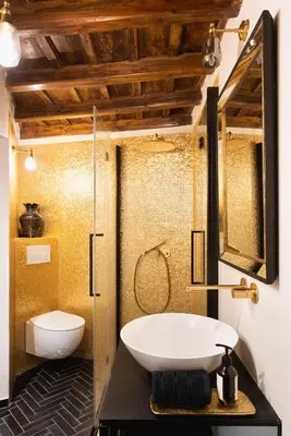 a bathroom with a sink and a glass shower at Idyllia - Luxury home with terrace in Rome