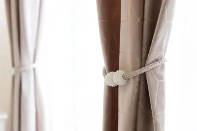 a curtain with a knot in a window at Just Chilling Home in Rome