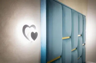a heart sign on the wall of a room at Just Chilling Home in Rome