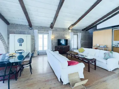 a living room with two white couches and a table at The Loft Boutique Apartment Vatican Museum in Rome