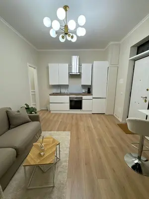 a living room with a couch and a table at JULIX - Roma Quadraro Apartment in Rome