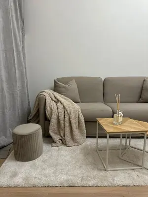 a living room with a couch and a table at JULIX - Roma Quadraro Apartment in Rome