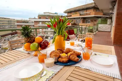 a living room with a couch and a table at Apartment near Vatican & Foro Italico - Rome in Rome